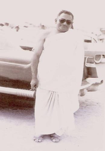 STANDING INFRONT OF HIS CAR DURING HAJJ