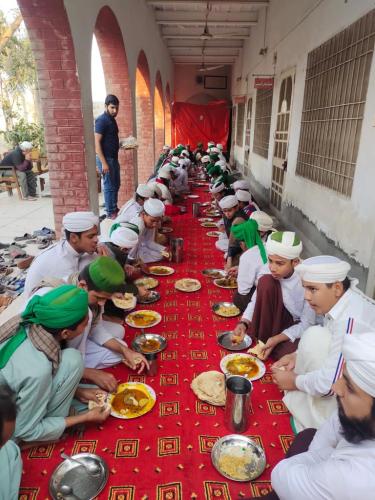 COOKED MEALS SERVED TO THE PEOPLE AFTER QURAN KHWANI